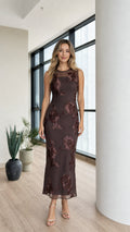 Front view of model wearing dark brown floral applique mesh midi dress