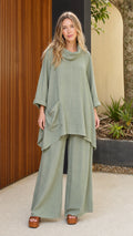 Front view of model wearing sage green cowl neck tunic and wide leg pants set