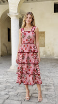 Front view of model wearing red striped floral embroidered midi dress
