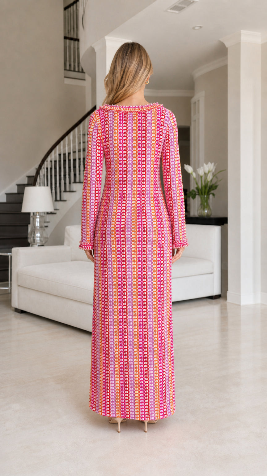 Back view of model wearing pink striped crochet maxi dress