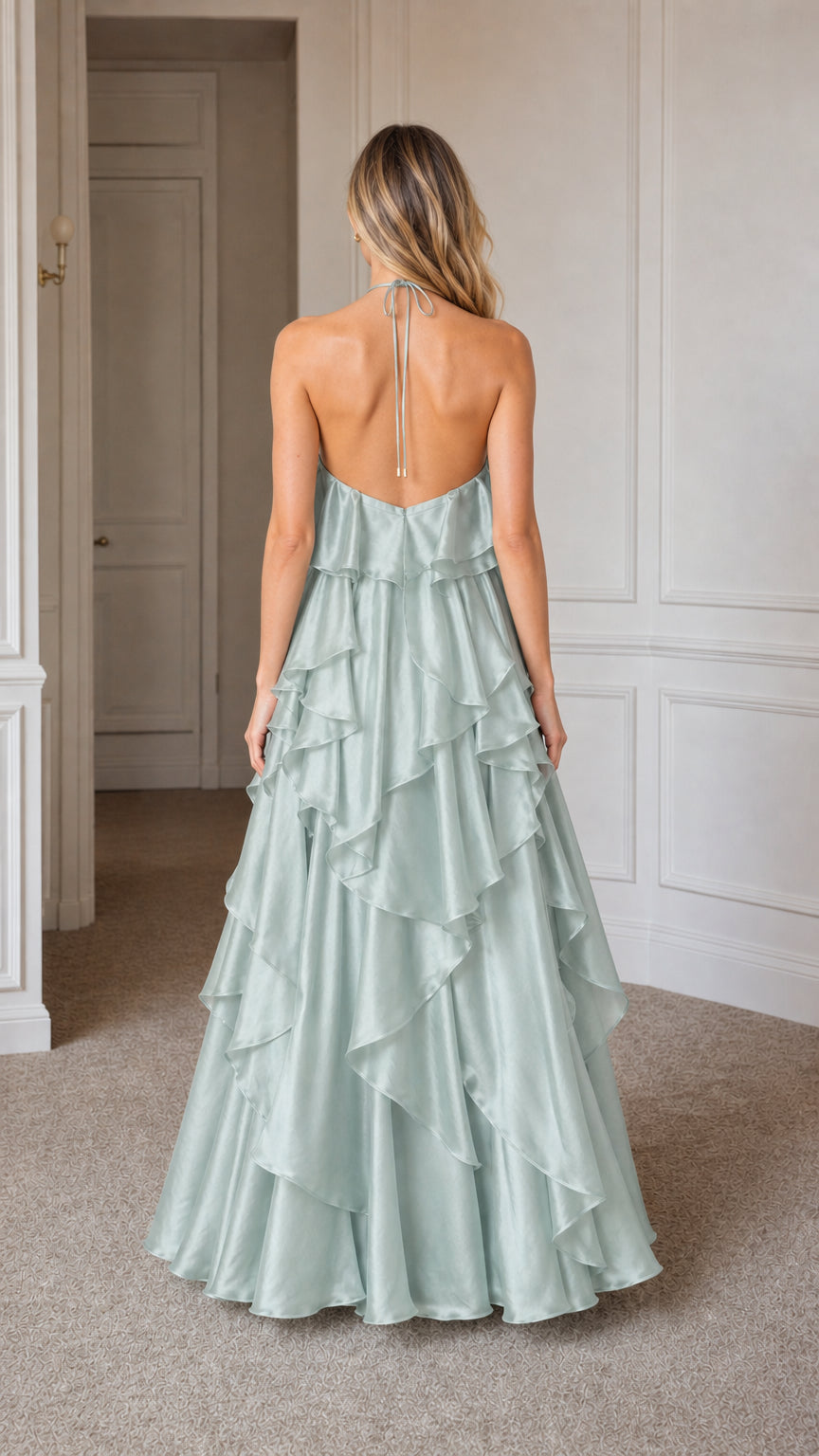 Back view showcasing open back and halter straps of sage green gown